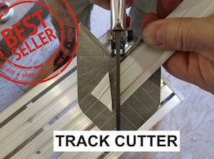 tool cutting a piece of track system